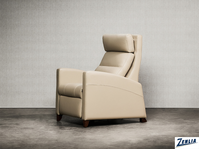 A beige recliner chair with a sleek design is set against a plain gray background, featuring a comfortable headrest and wooden legs.