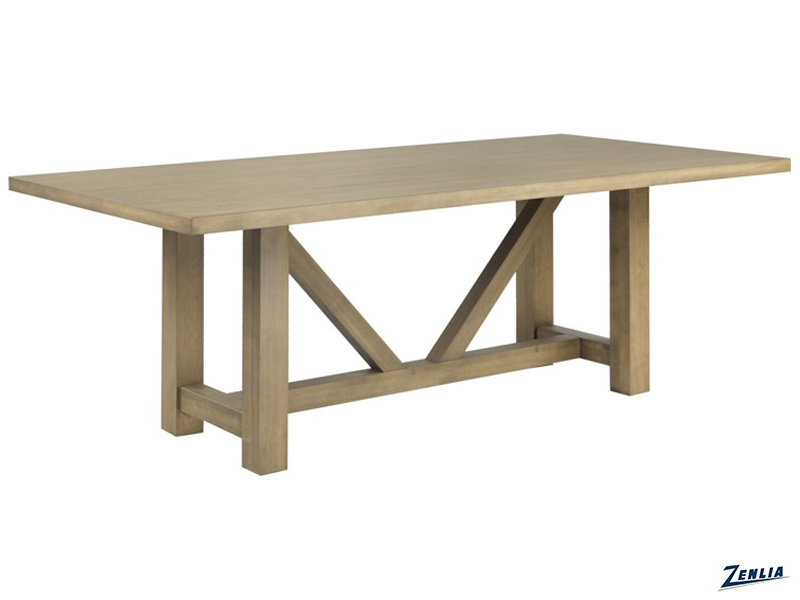 A wooden dining table with a rectangular top and sturdy legs, featuring a distinctive V-shaped support structure underneath. The table has a light, natural wood finish, and the brand name 