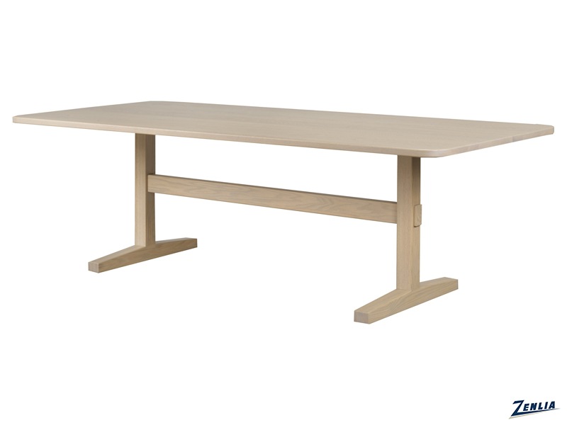 A light wooden dining table with a rectangular top and sturdy T-shaped legs, set against a plain white background.